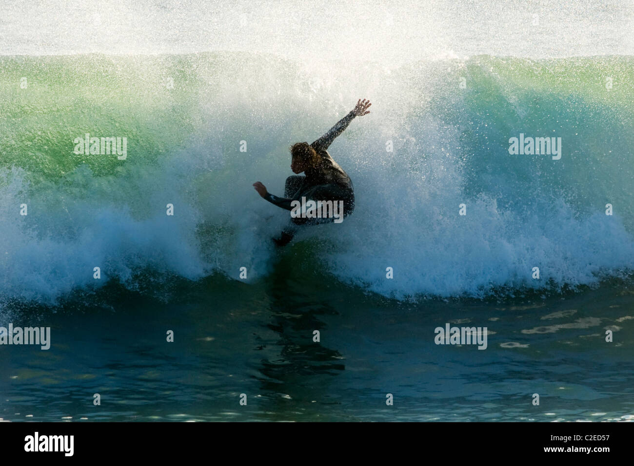 Surfer Catching A Wave Stock Photo Alamy