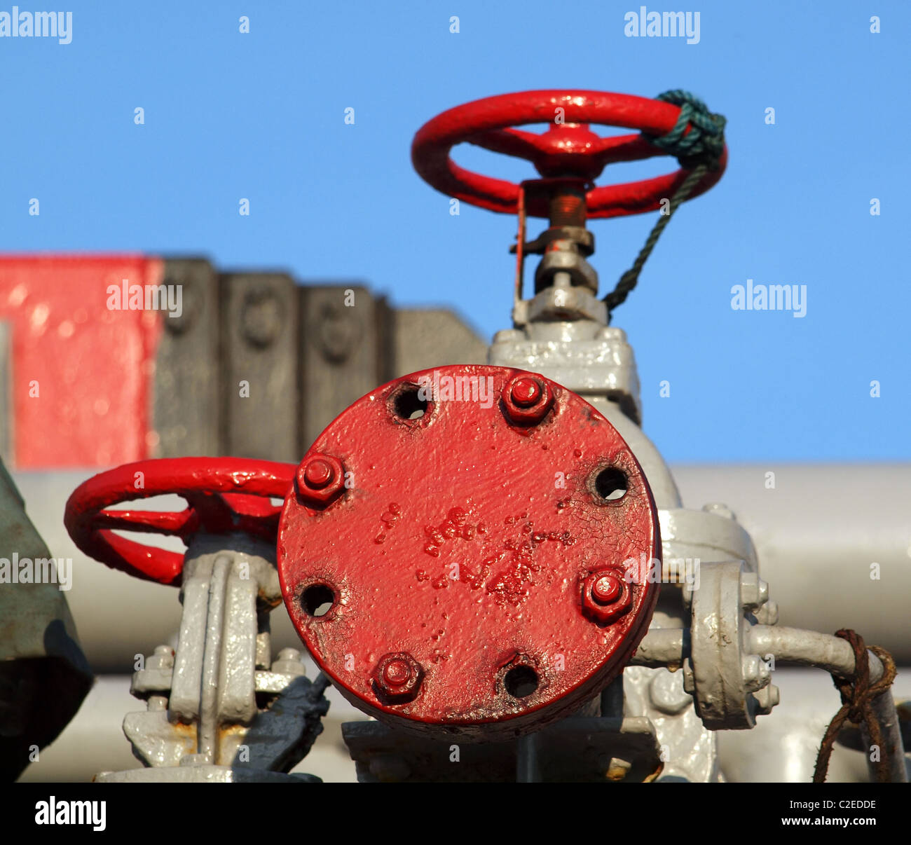 Valves and pipes at an oil installation Stock Photo Alamy