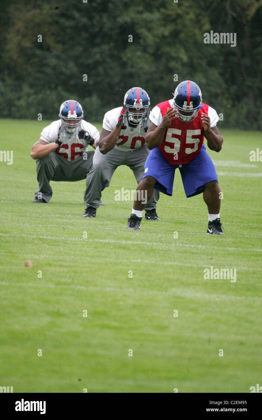 New York Giants train at the Chelsea Football Club's training facility in Cobham, Surrey before the New York Giants play the Stock Photo