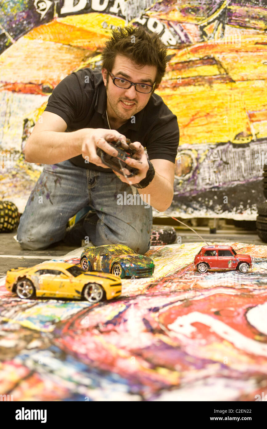 11.4.2011 Ian Cook who paints cars using remote controlled toy cars and ...