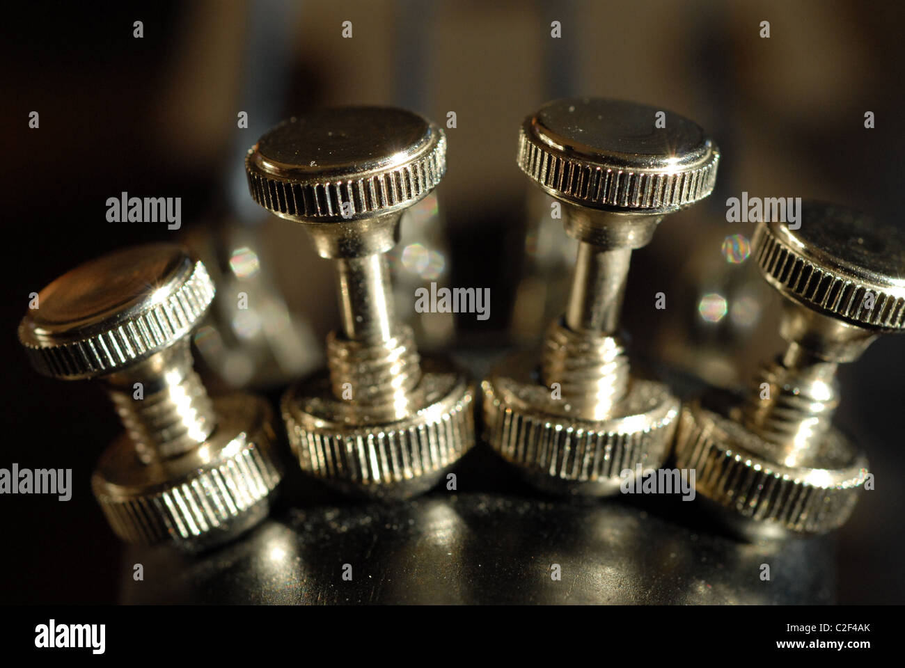 Fine tuners on the tailpiece of a cello Stock Photo Alamy