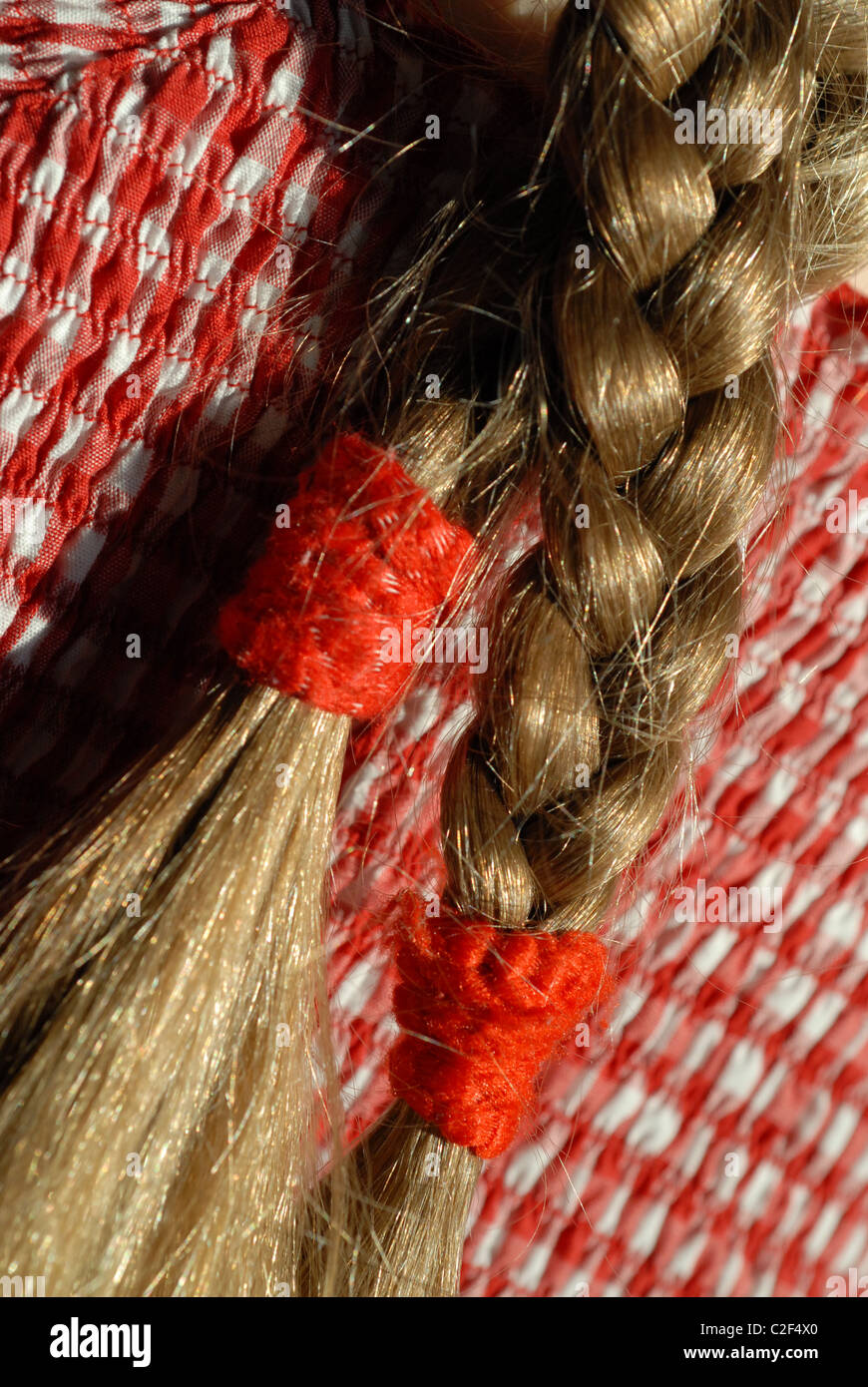 Hair braids red ribbon hi-res stock photography and images - Alamy