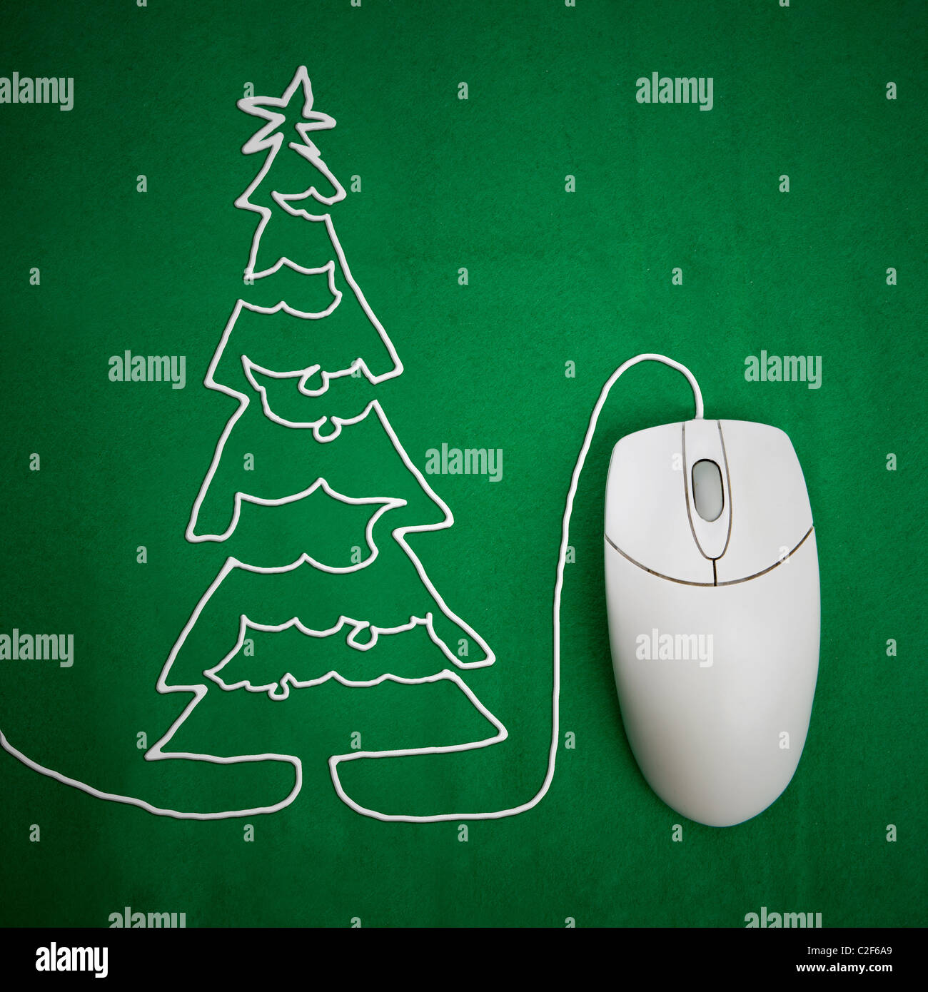 Online christmas shopping concept, mouse on green background with christmas tree Stock Photo