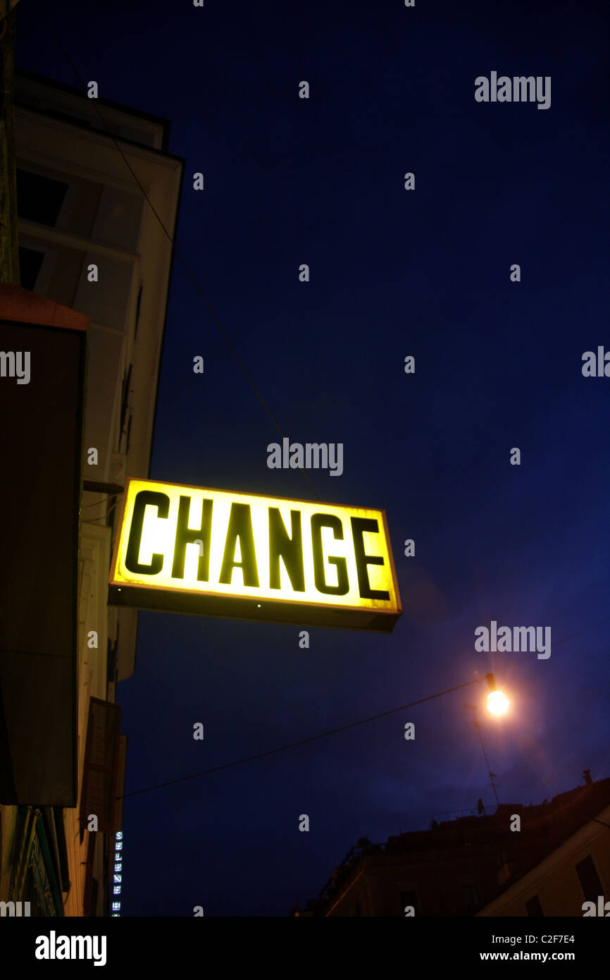 foreign currency exchange change point shop sign notice at night in