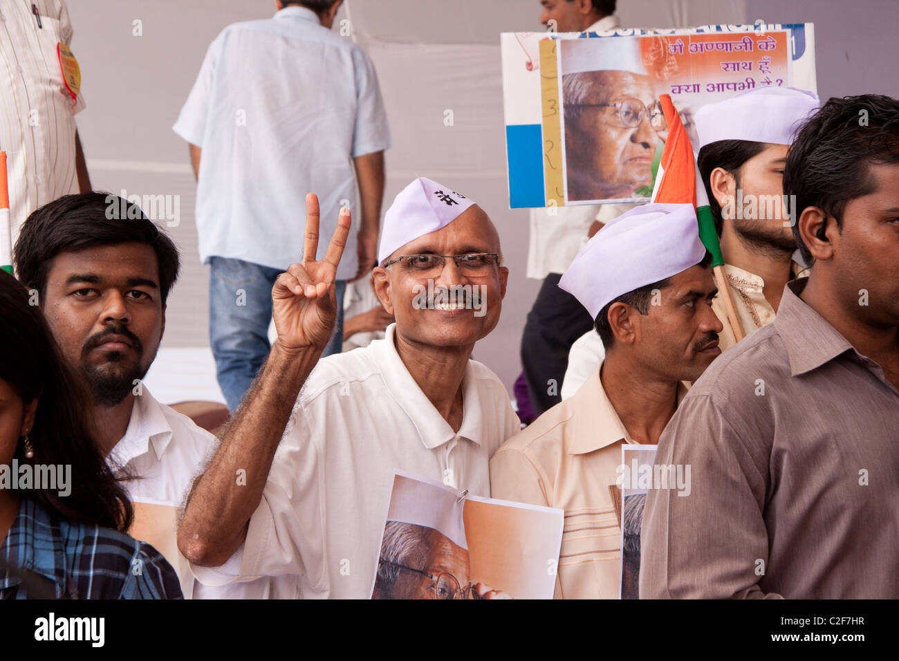 A supporter of Anna Hazare's anti corruption rally showing victory sign at Azad Maidan in Mumbai (Bombay), Maharashtra, India. Stock Photo