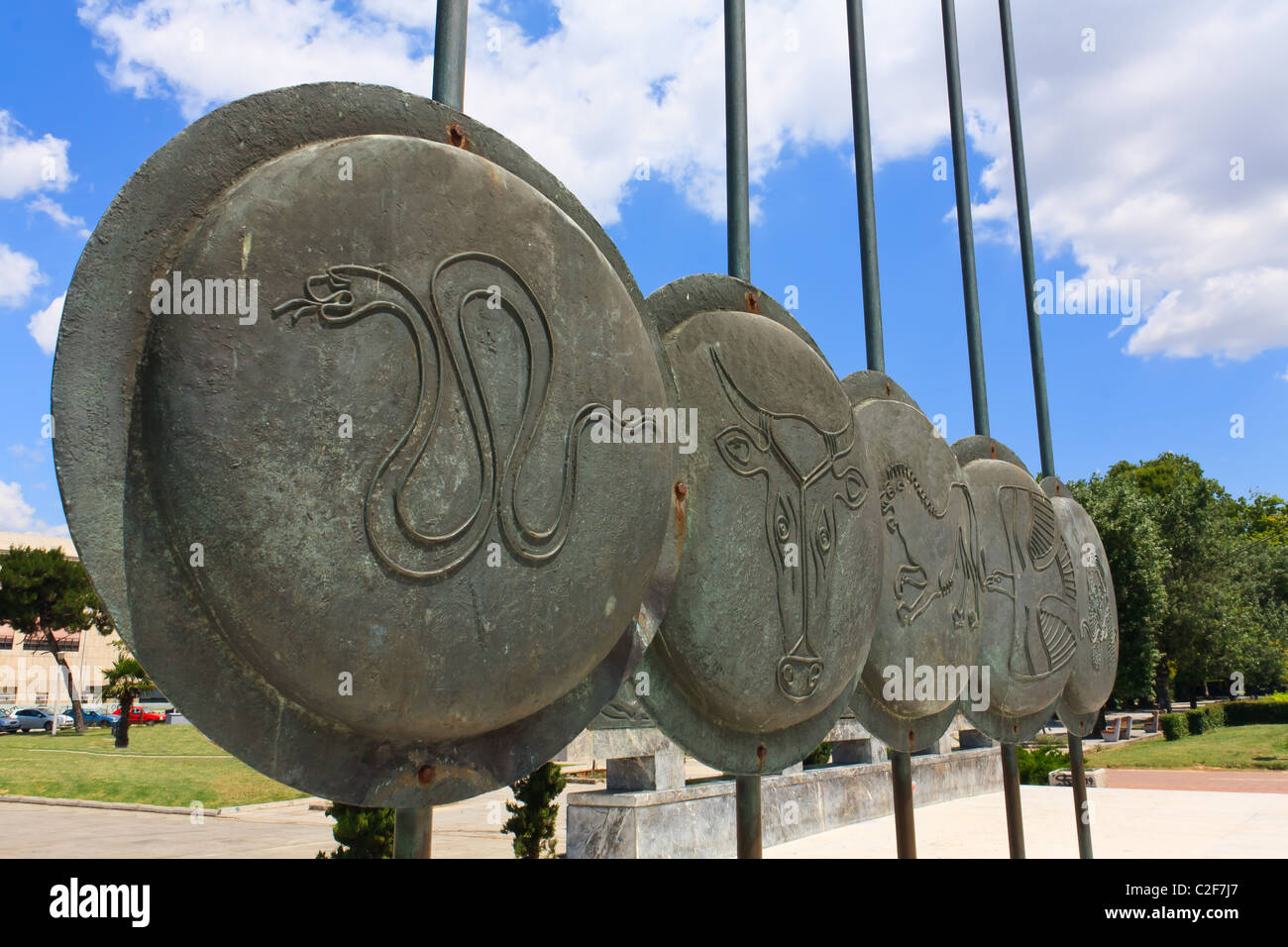 Ancient Macedonian shields next to Alexander the Great monument Stock