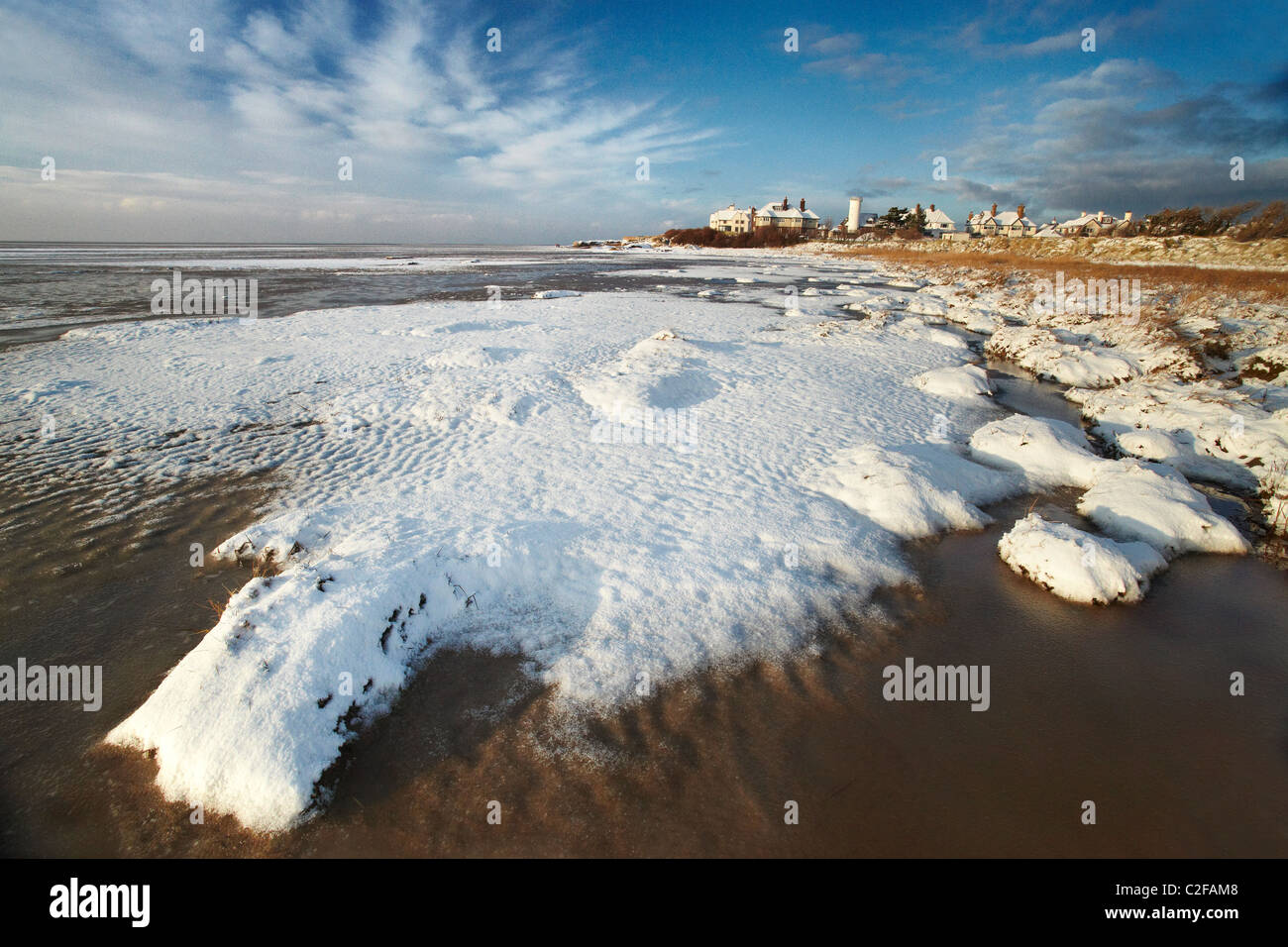 Snow covers the beach at Red Rocks. Hoylake, Wirral, Merseyside, UK Stock Photo
