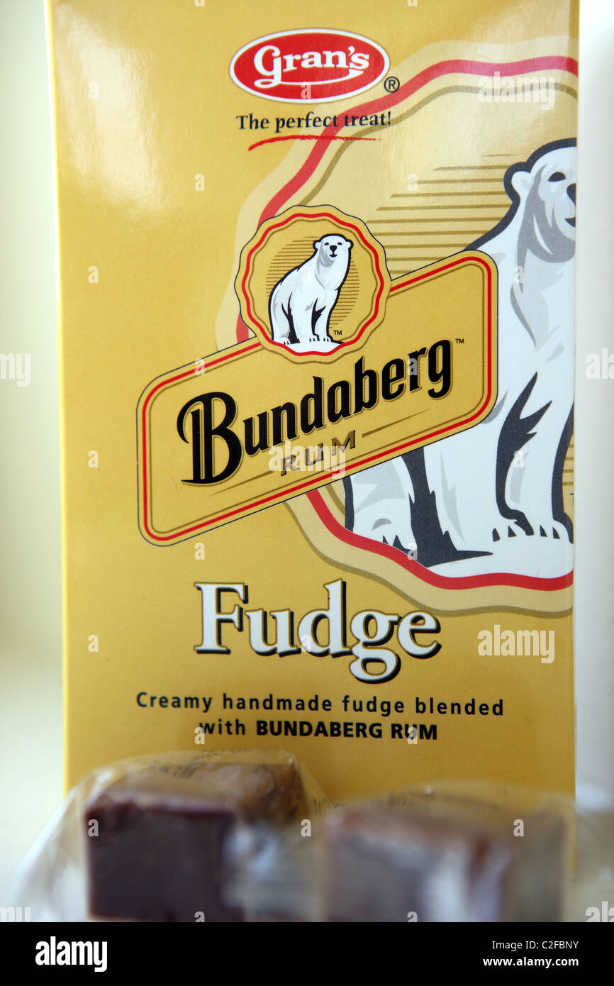 Box of Australian Bundaberg fudge with a couple of fudge on the counter in front. Stock Photo