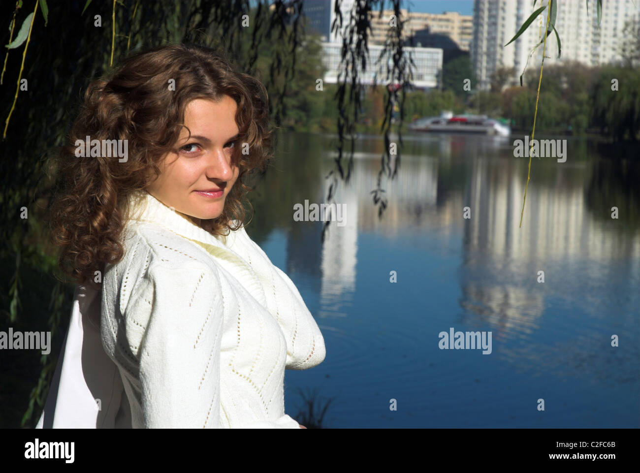 Young pretty woman is walking in the park Stock Photo - Alamy
