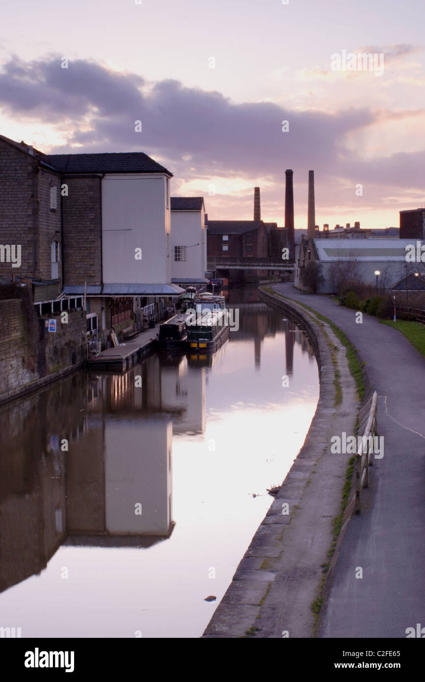 Canal and chimneys at sunset, Shipley, West Yorkshire, UK Stock Photo
