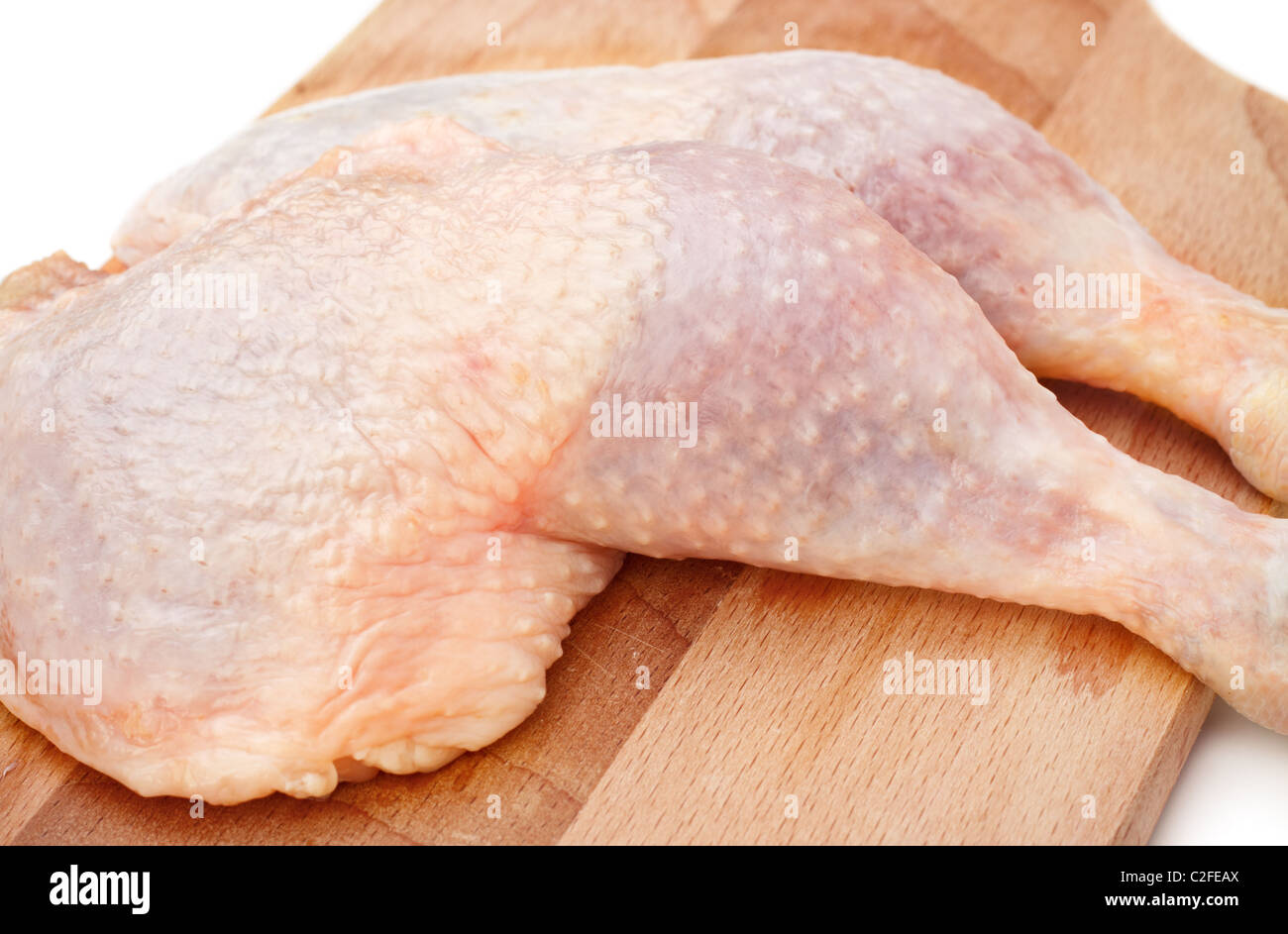 fresh chicken thighs laying on cutting board Stock Photo Alamy