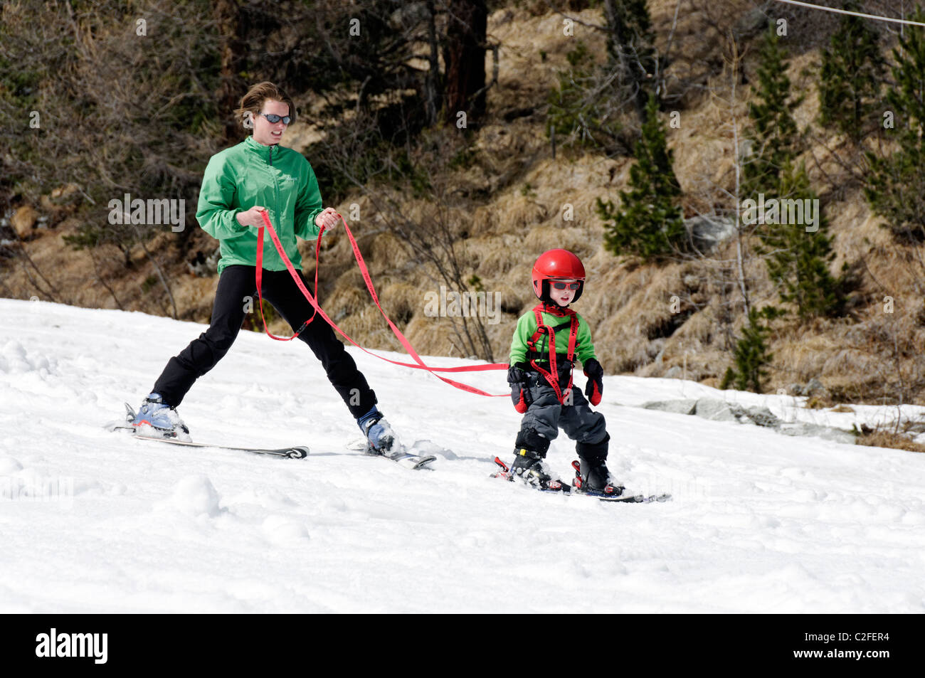 A young boy learning to ski on snow Stock Photo Alamy
