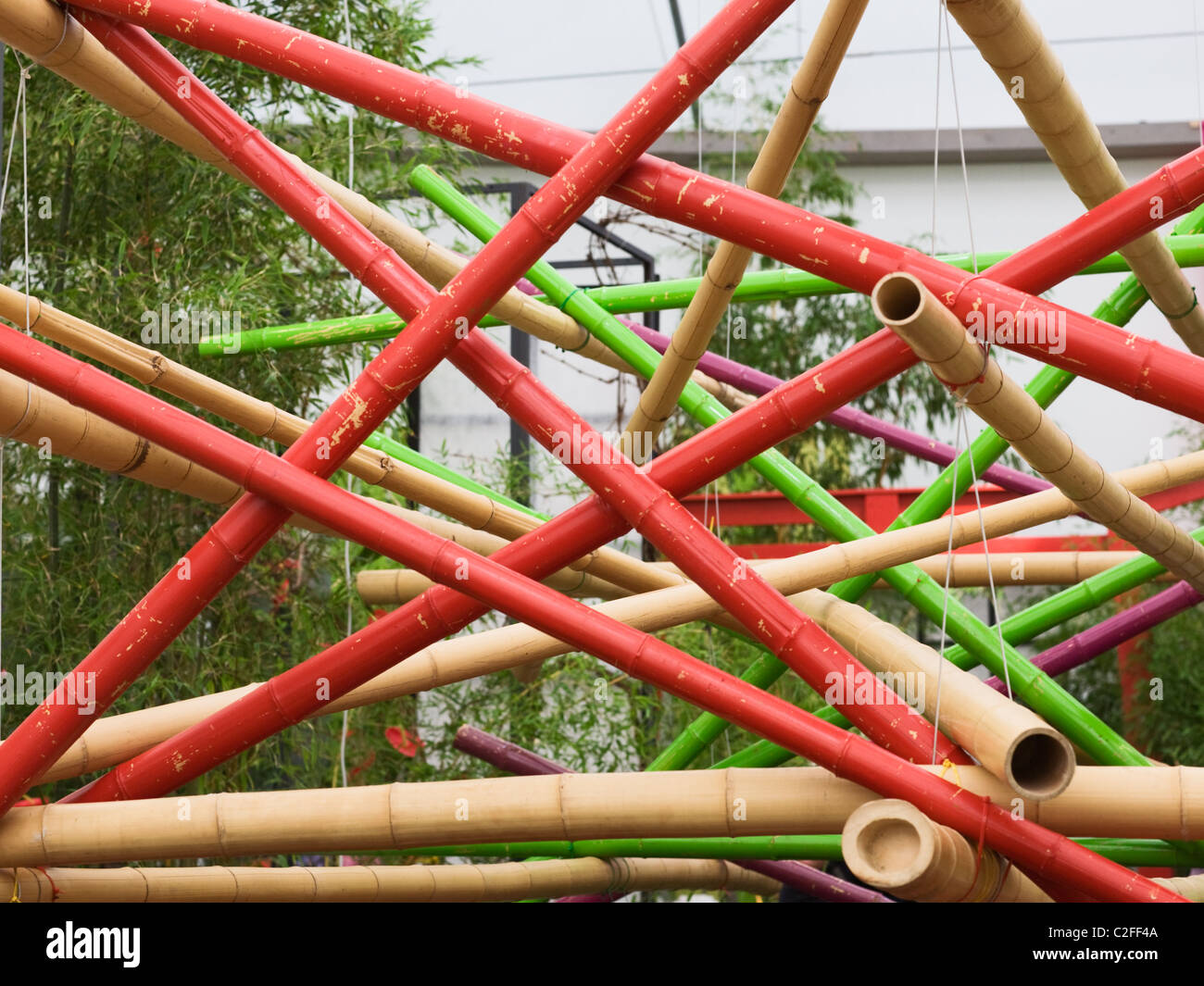 Painted bamboo poles creative arranged Stock Photo - Alamy