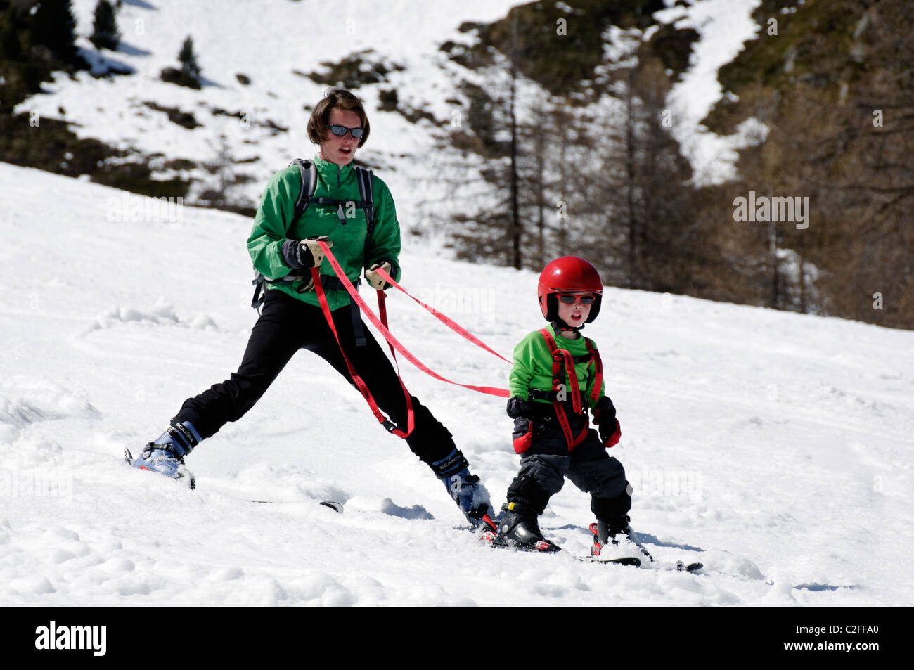A young boy learning to ski on snow Stock Photo Alamy