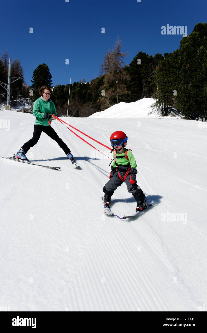 A young boy learning to ski on snow Stock Photo Alamy