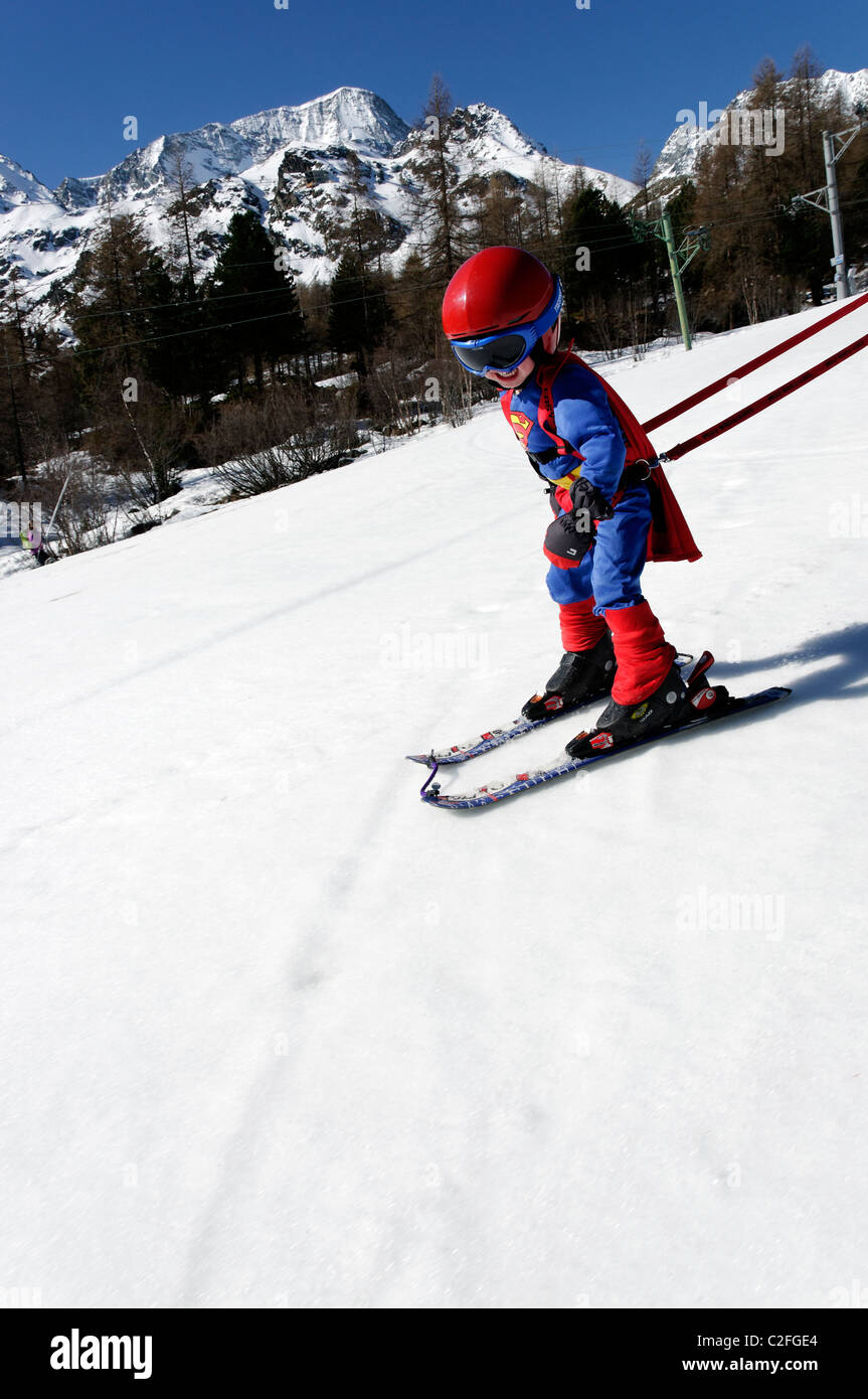 A young boy learning to ski on snow Stock Photo Alamy