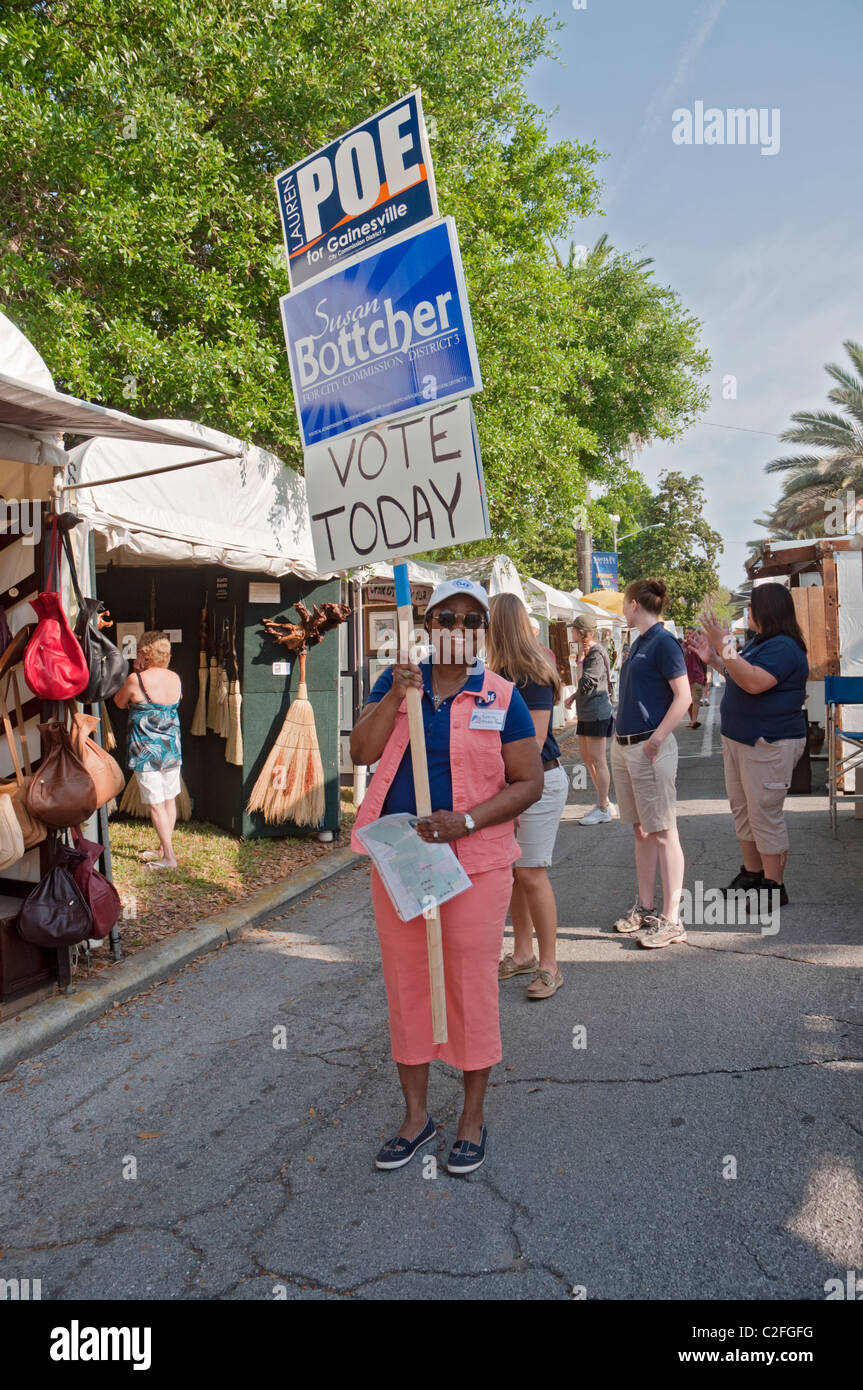 Spring Arts Festival Gainesville Florida woman election campaigning during festival Stock Photo