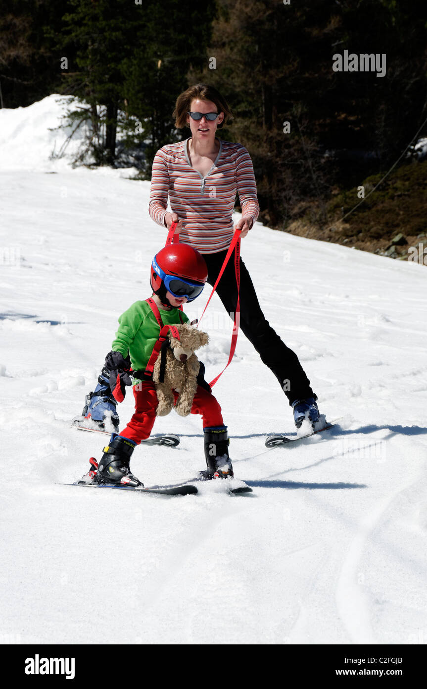A young boy learning to ski on snow Stock Photo Alamy