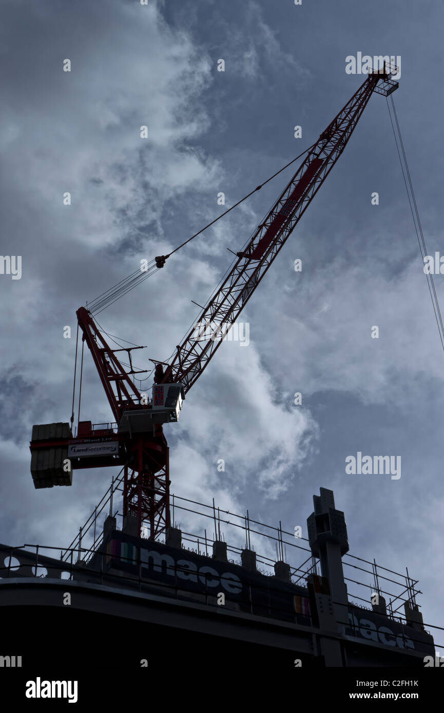 Construction crane against a blue sky Stock Photo