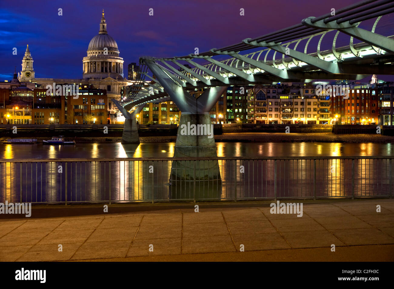 Night view of St. Paul's Cathedral and the Millennium Bridge from the Southbank, London, England, UK Stock Photo