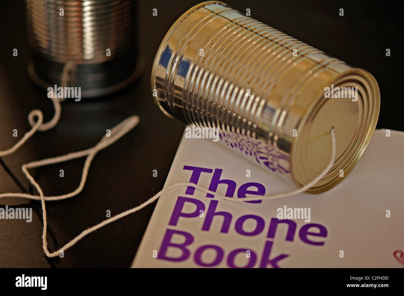 Concept image of a telephone made from two tin cans and a piece of string Stock Photo