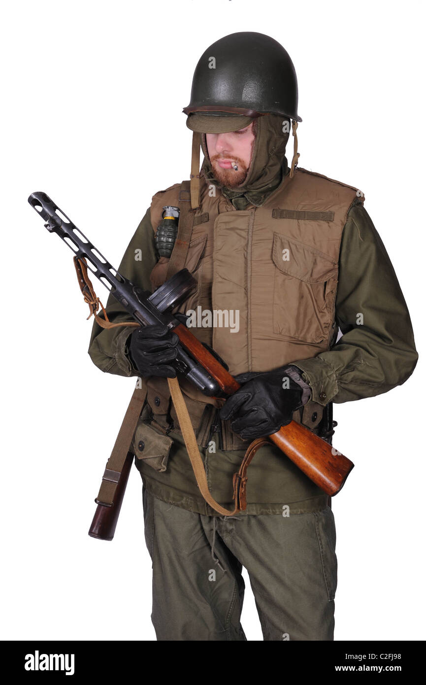 Reconstruction of a Korean War American GI. He wears the ‘Armor, Body, M1952’ vest with M1 helmet and cold weather clothing. Stock Photo