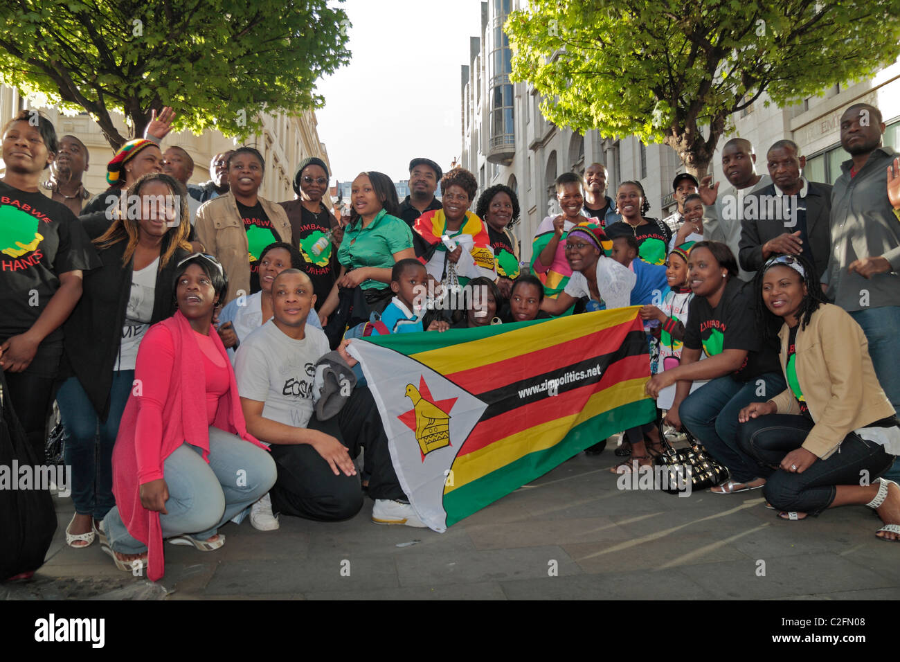 Crowd at a weekly anti-Robert Mugabe protest outside the Zimbabwe Embassy on the Strand, in Central London, UK. Stock Photo