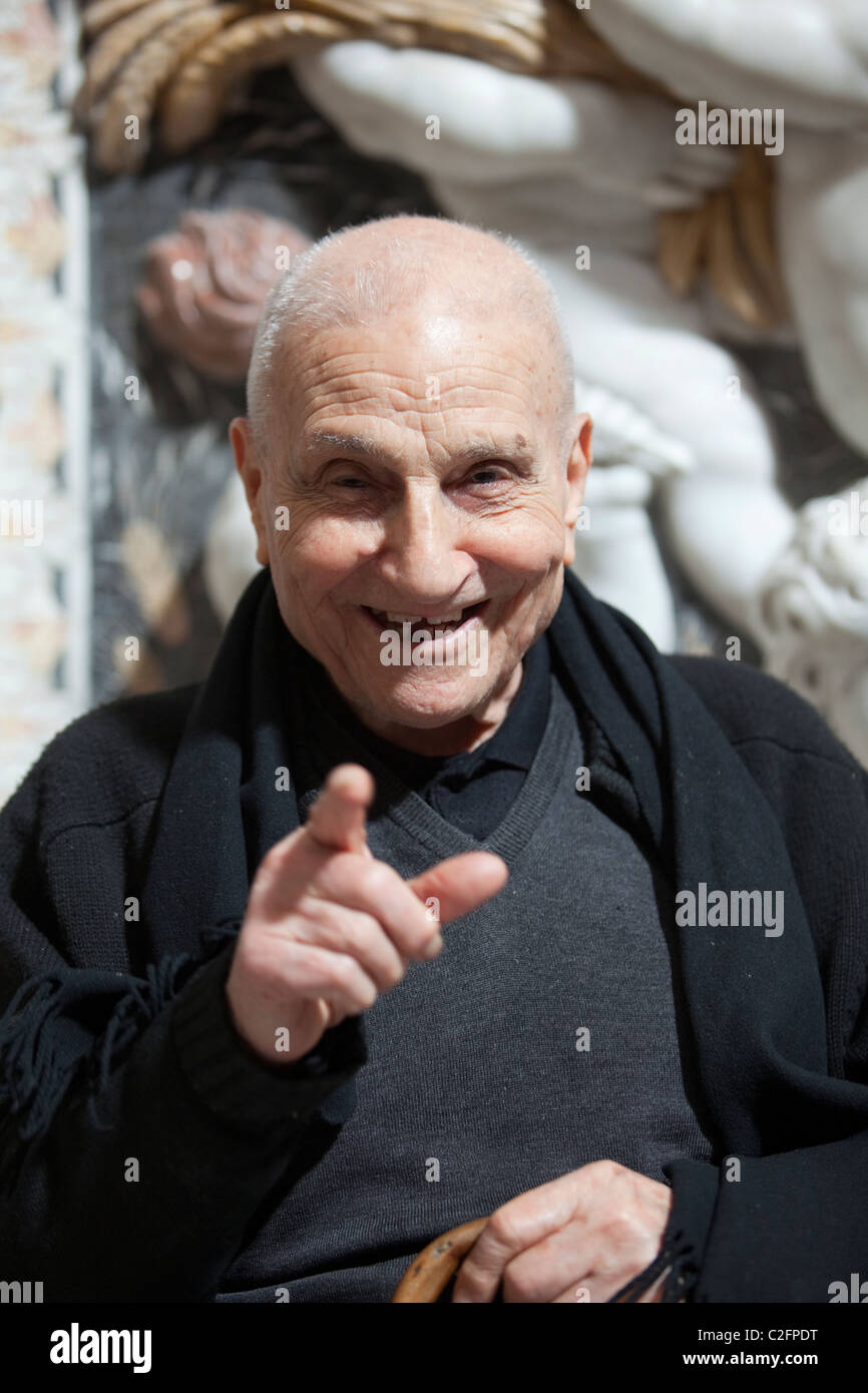 An old man sits and smiles at Jesus church, Palermo, Sicily, Italy (Chiesa di Casa Professor) Stock Photo