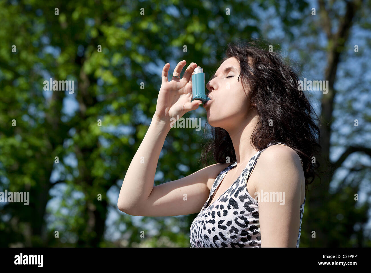 woman with inhaler Stock Photo