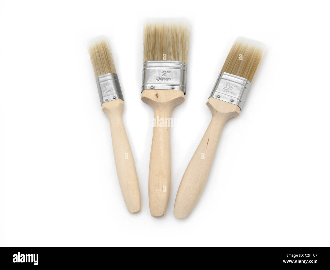 Three Different Sized Flat Brushes Stock Photo