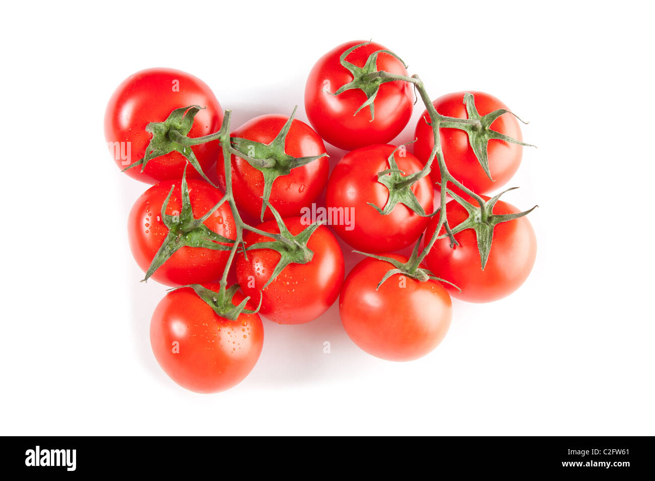 Picture of red tomatoes isolated on white Stock Photo - Alamy