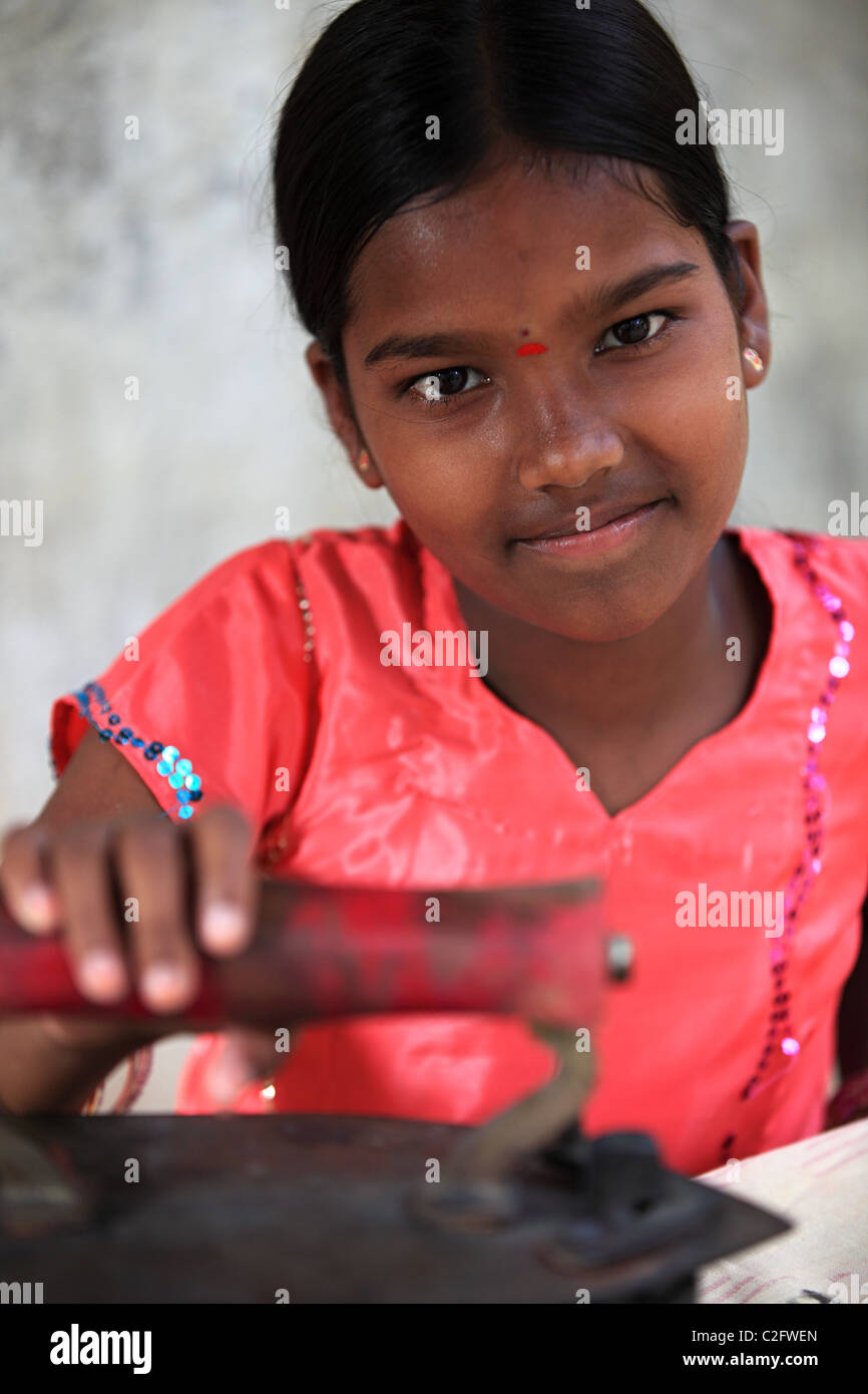Indian girl holding an old style iron Andhra Pradesh South India Stock Photo - Alamy Indian girl holding an old style iron Andhra Pradesh South India Stock Photo - Alamy