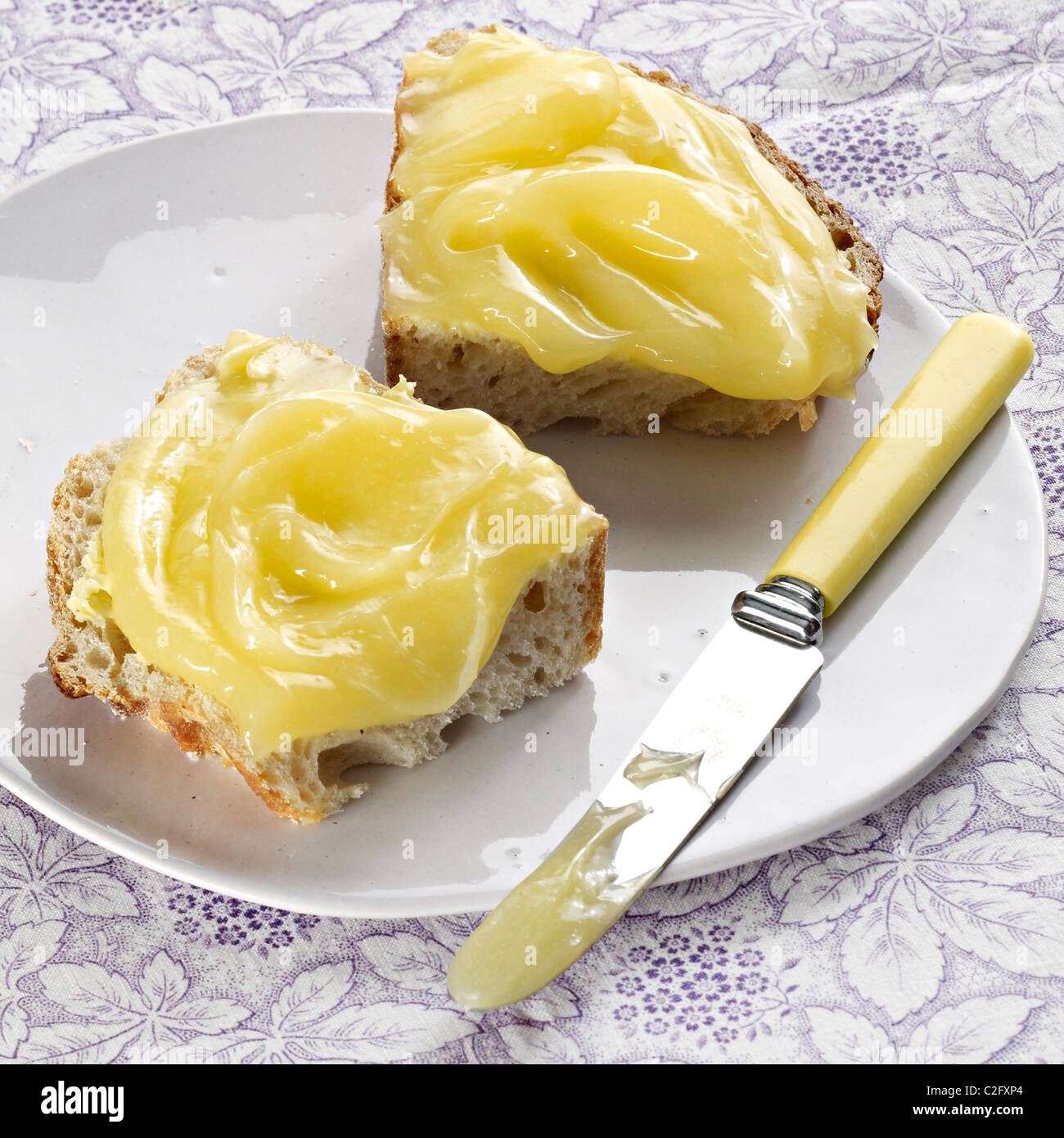 Lemon curd spread thick on bread Stock Photo Alamy