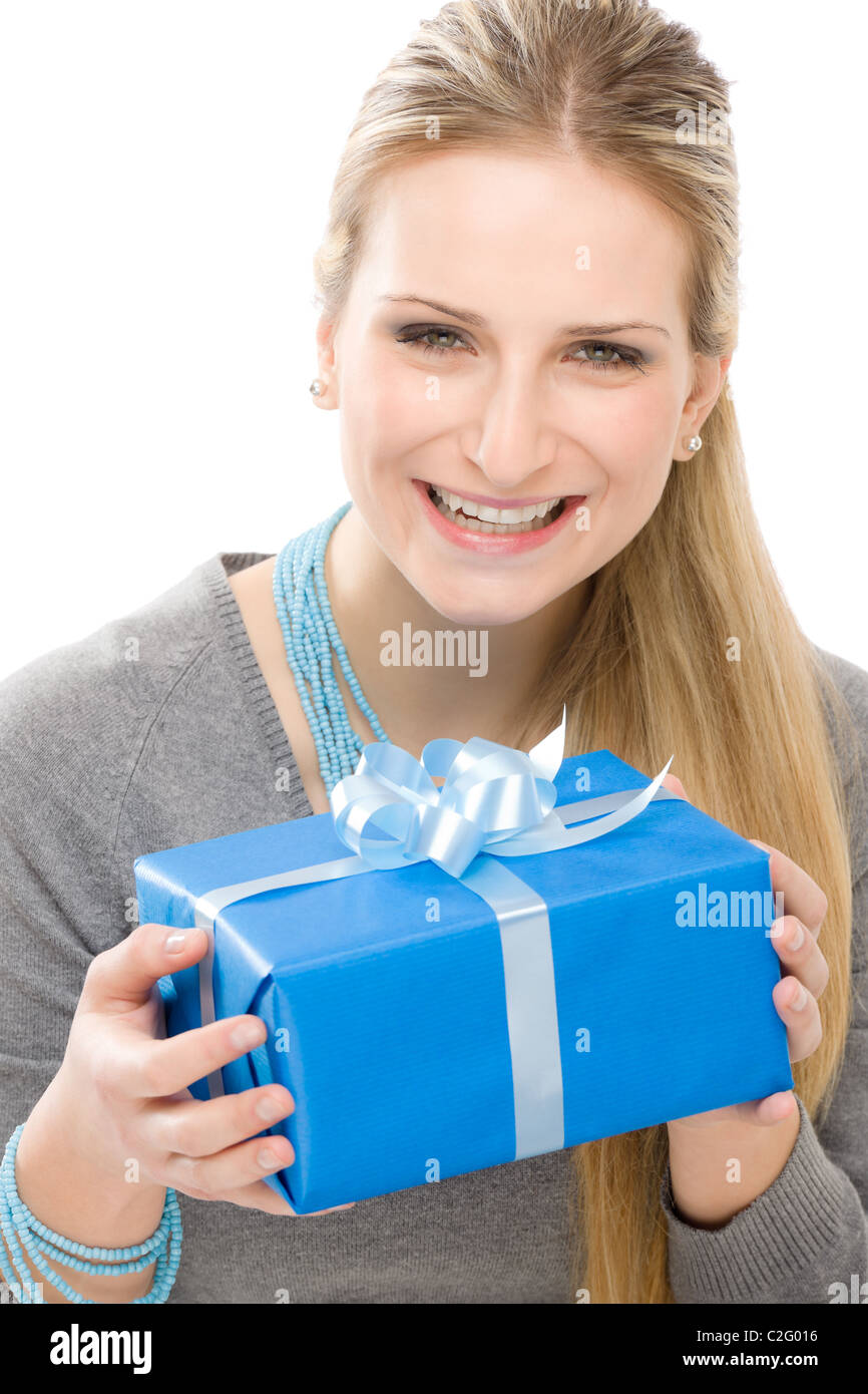 Young happy woman hold blue present with ribbon Stock Photo - Alamy