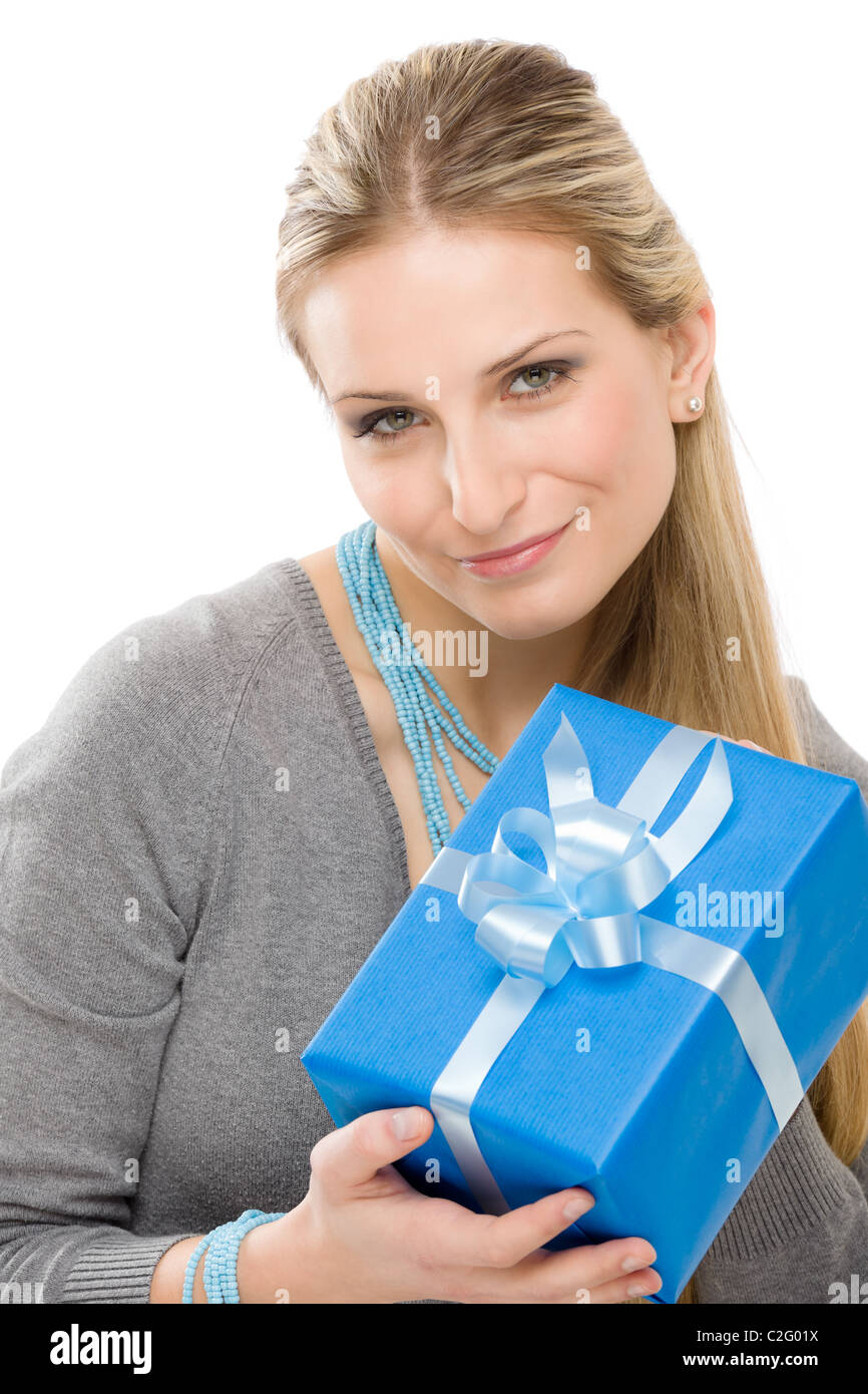 Young happy woman hold blue present with ribbon Stock Photo - Alamy