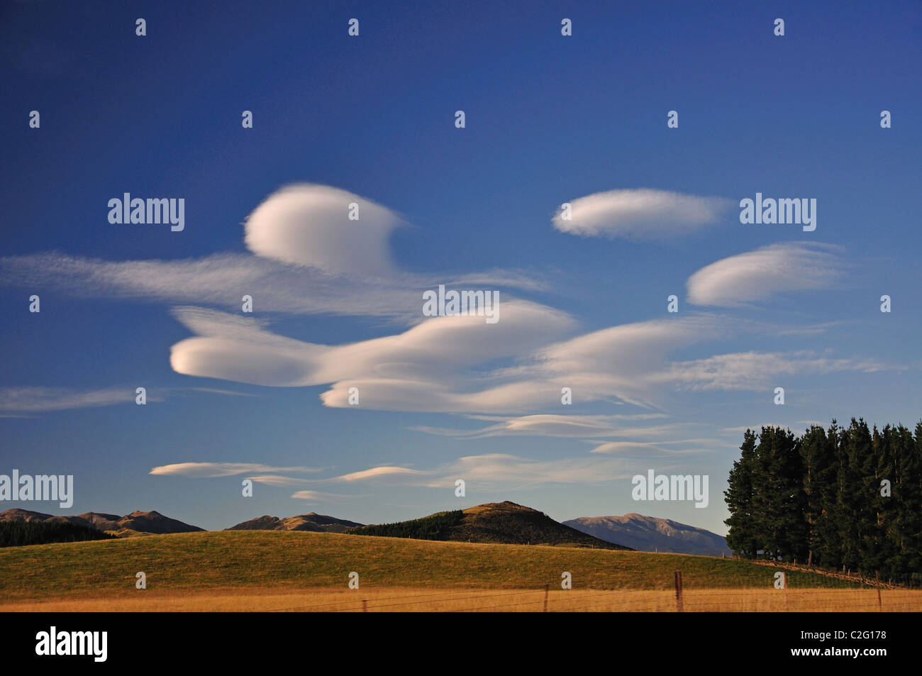 Altocumulus Lenticularis cloud formations, near Southern Alps, Canterbury Region, South Island, New Zealand Stock Photo