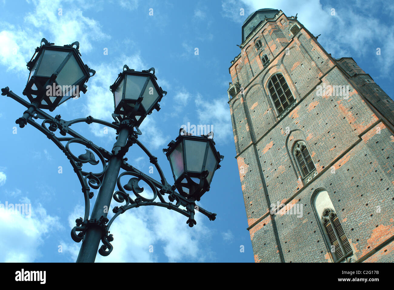 Gothic tower of Saint Elizabeth's church and the street lamp Wroclaw Poland Stock Photo