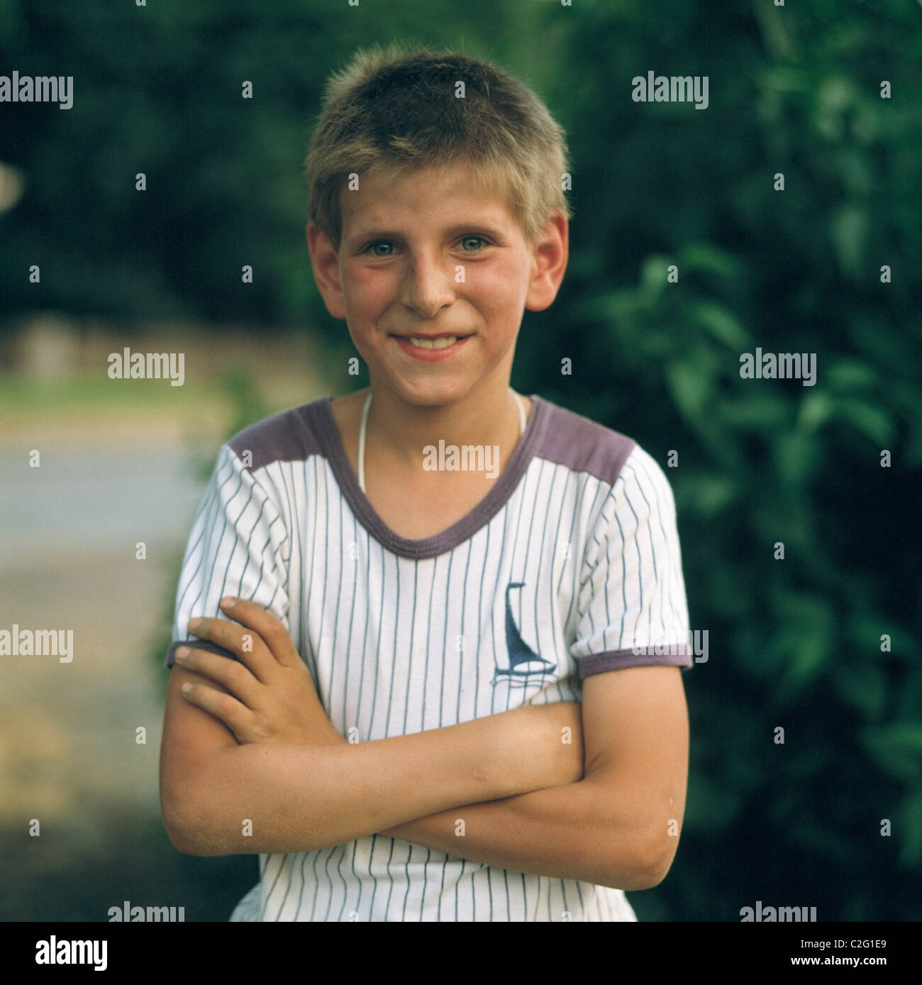 Eighties, people, child, boy, folded arms, portrait, aged 10 to 14 years, short hair Stock Photo