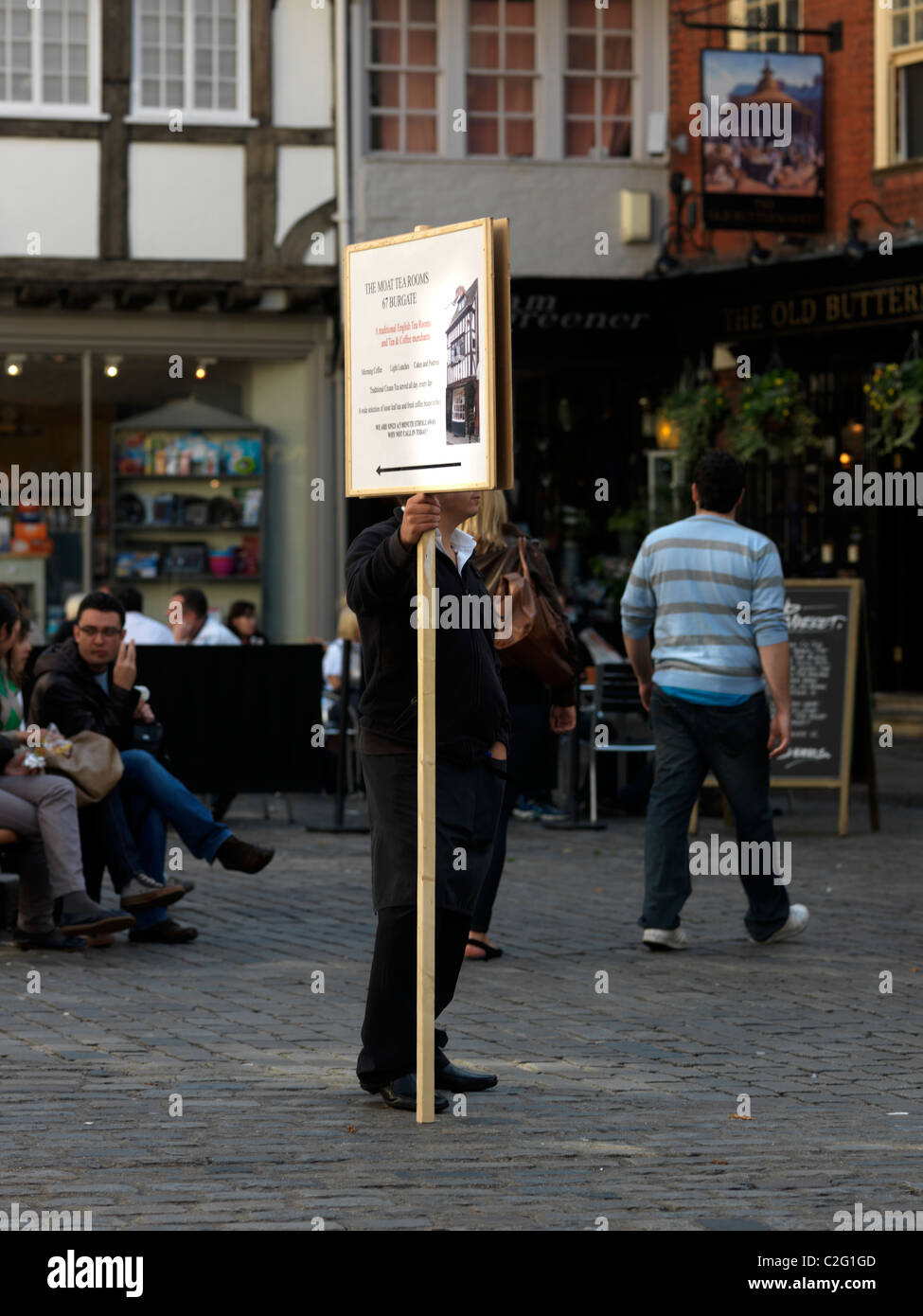 Canterbury Kent England Butter Market Man Holding A Placard Advertising The Moat Tea rooms Stock Photo