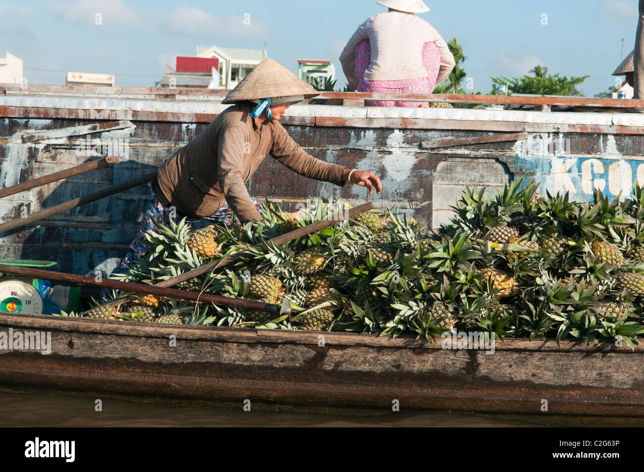 fruit and produce being bought and sold at the Cai Rang Floating Market in the Mekong Delta in Vietnam Stock Photo