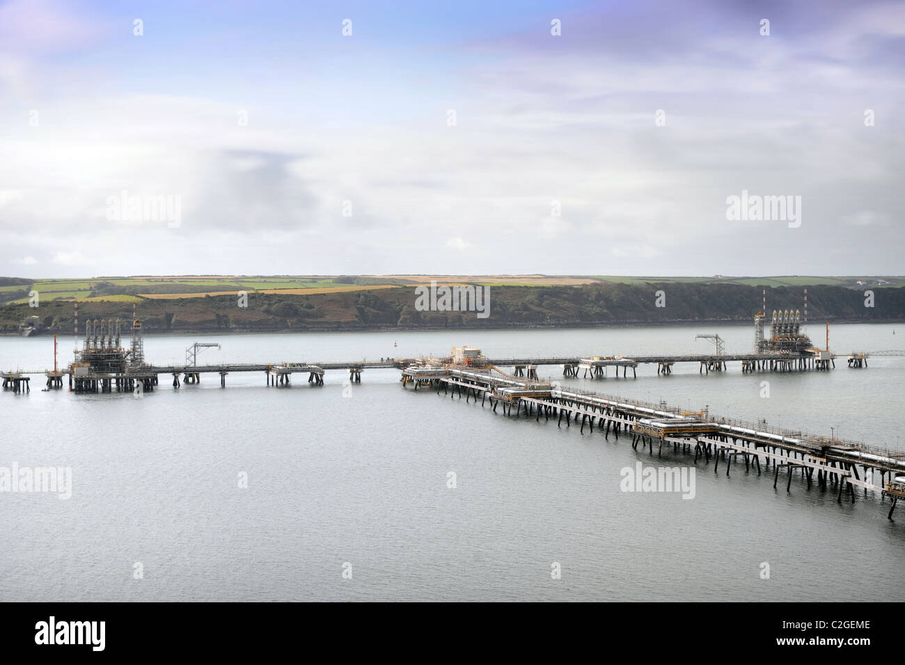 View from Milford Haven across the bay to the oil refinery at Rhoscrowther Wales UK Stock Photo