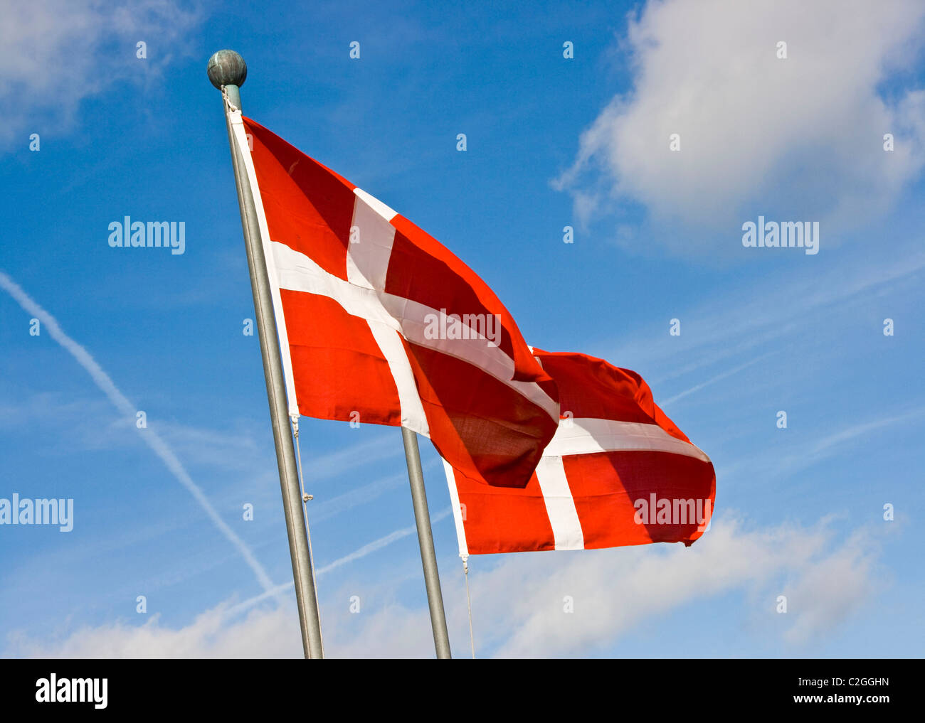 A pair two of Danish flags flying Copenhagen Denmark Europe Stock Photo