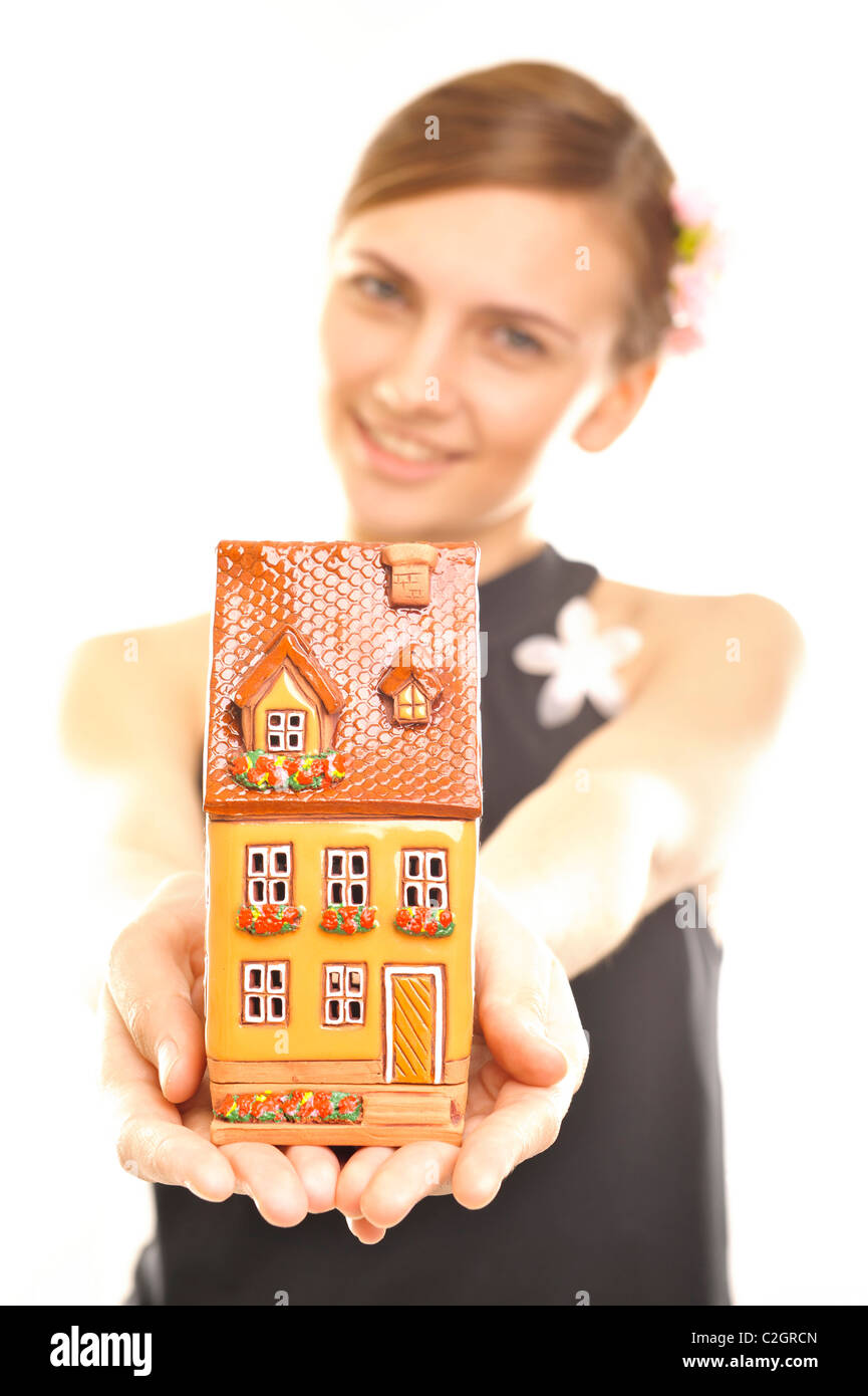 Young beautiful business woman with house model - real estate, mortgage ...