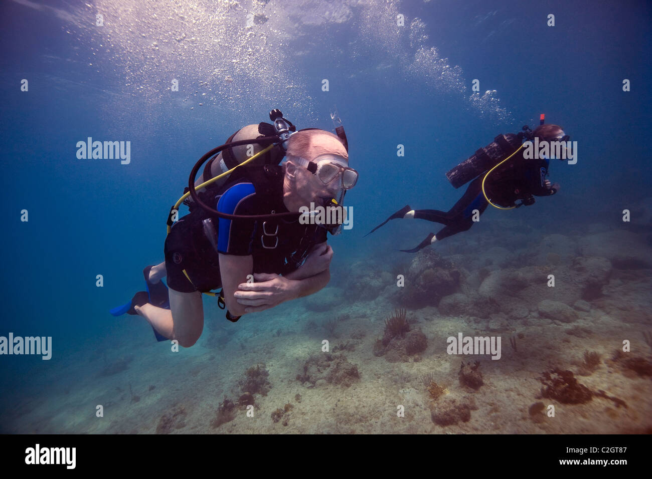 Two scuba divers diving near English Harbour, Antigua. Stock Photo