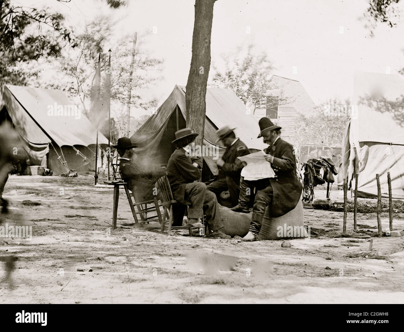 Gen. Ambrose E. Burnside (reading newspaper) with Mathew B. Brady (nearest tree) at Army of the Potomac headquarters Stock Photo