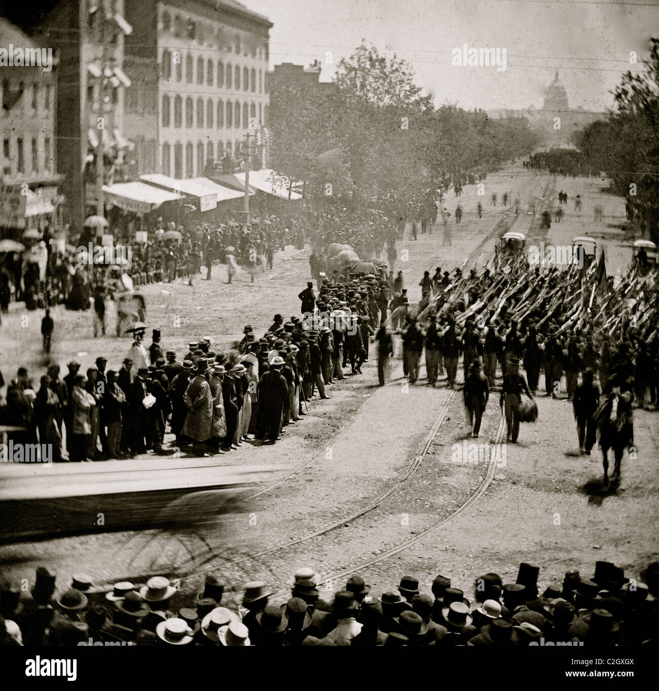 Washington, D.C. Infantry unit with fixed bayonets followed by ambulances passing on Pennsylvania Avenue near the Treasury Stock Photo