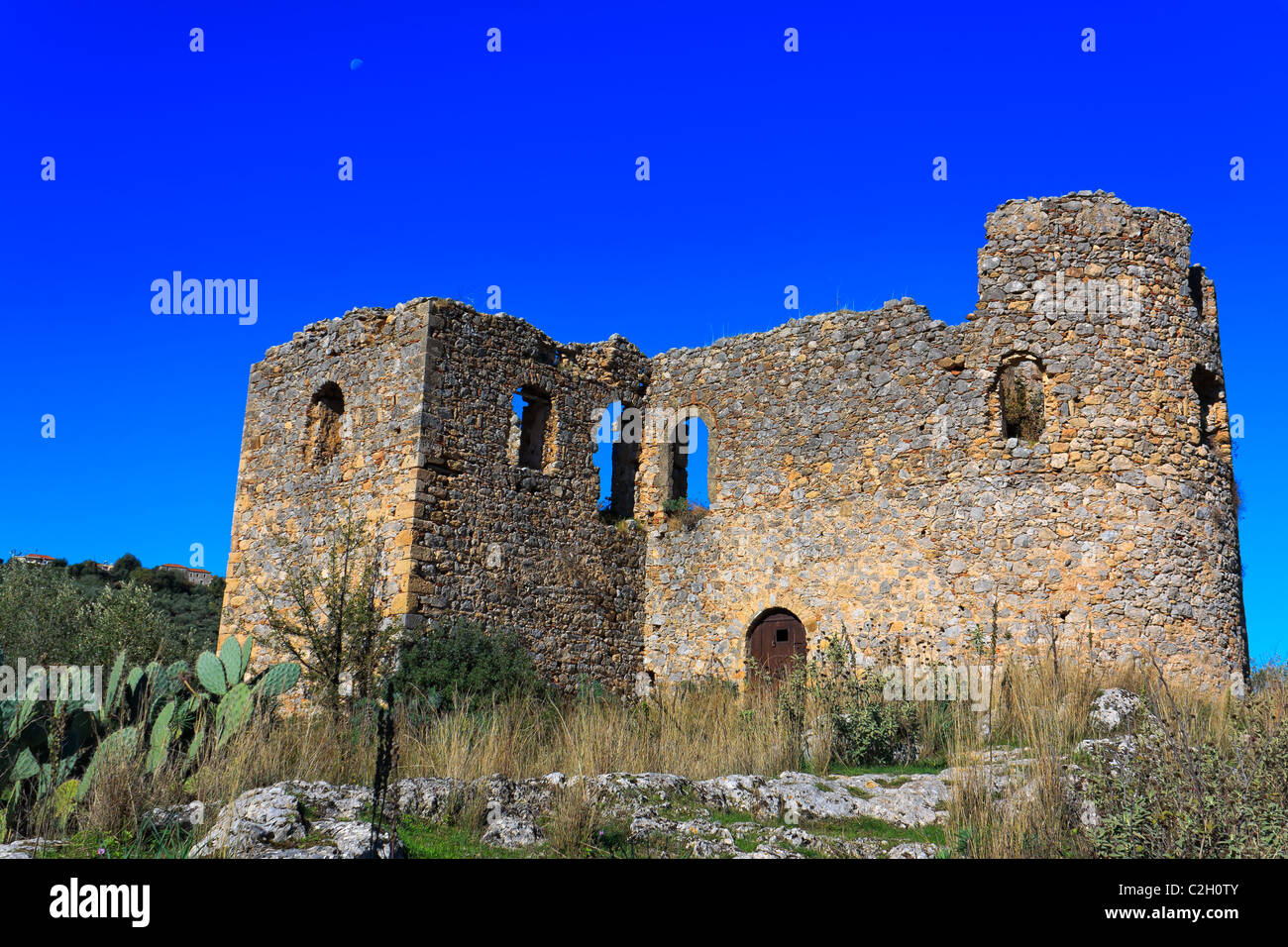 Typical stone Tower-house ruins in Mani, Greece Stock Photo