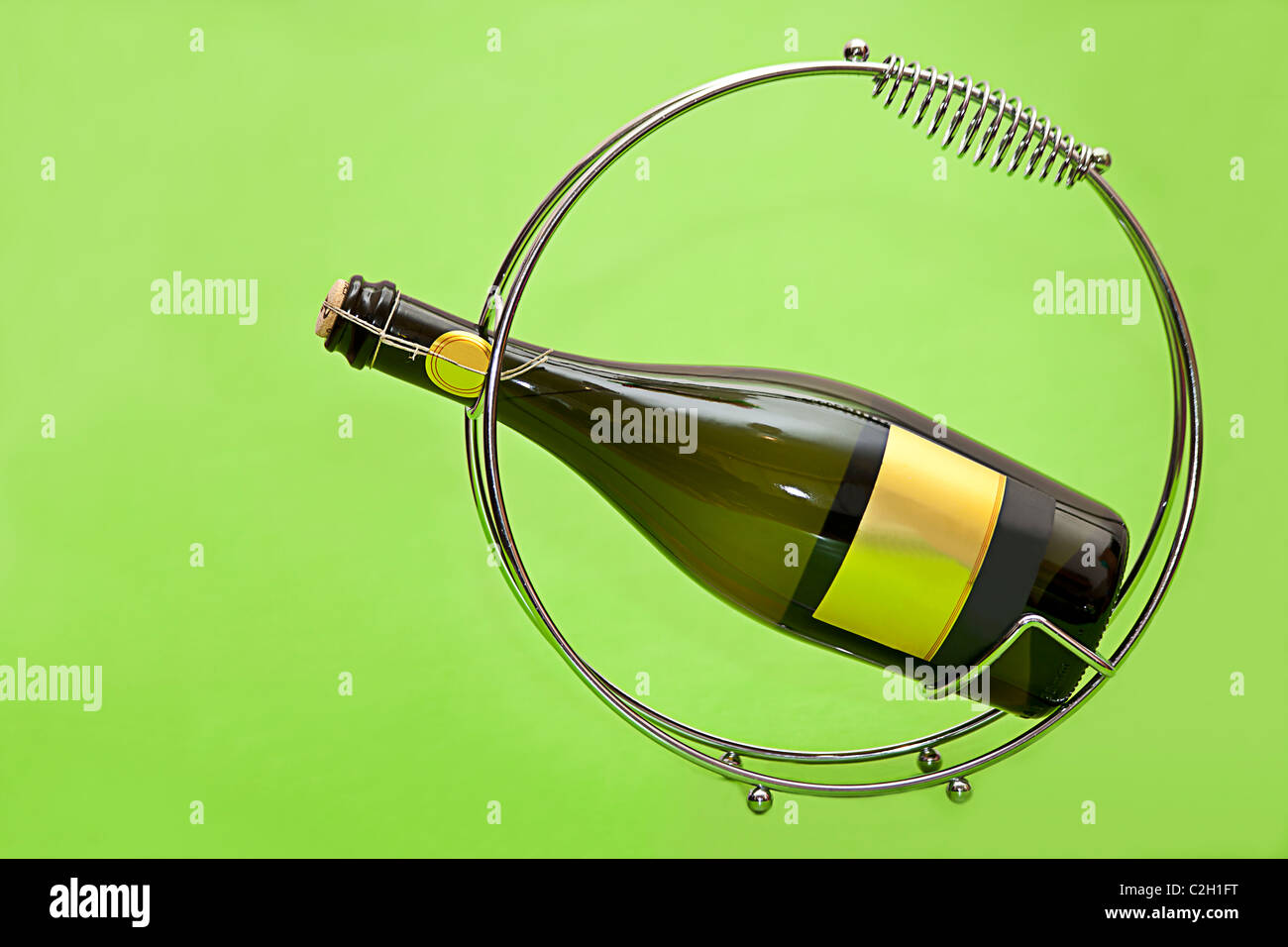 bottle of wine on the green background Stock Photo - Alamy