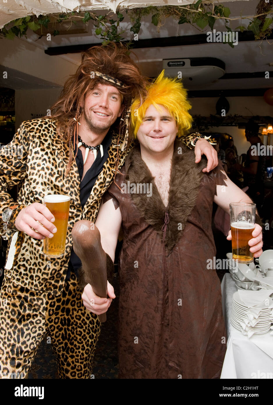 Pictured are best man Barney Rubble, Simon Whiteside and usher Will  Robinson as a caveman at Flintstones themed wedding, Devon Stock Photo -  Alamy