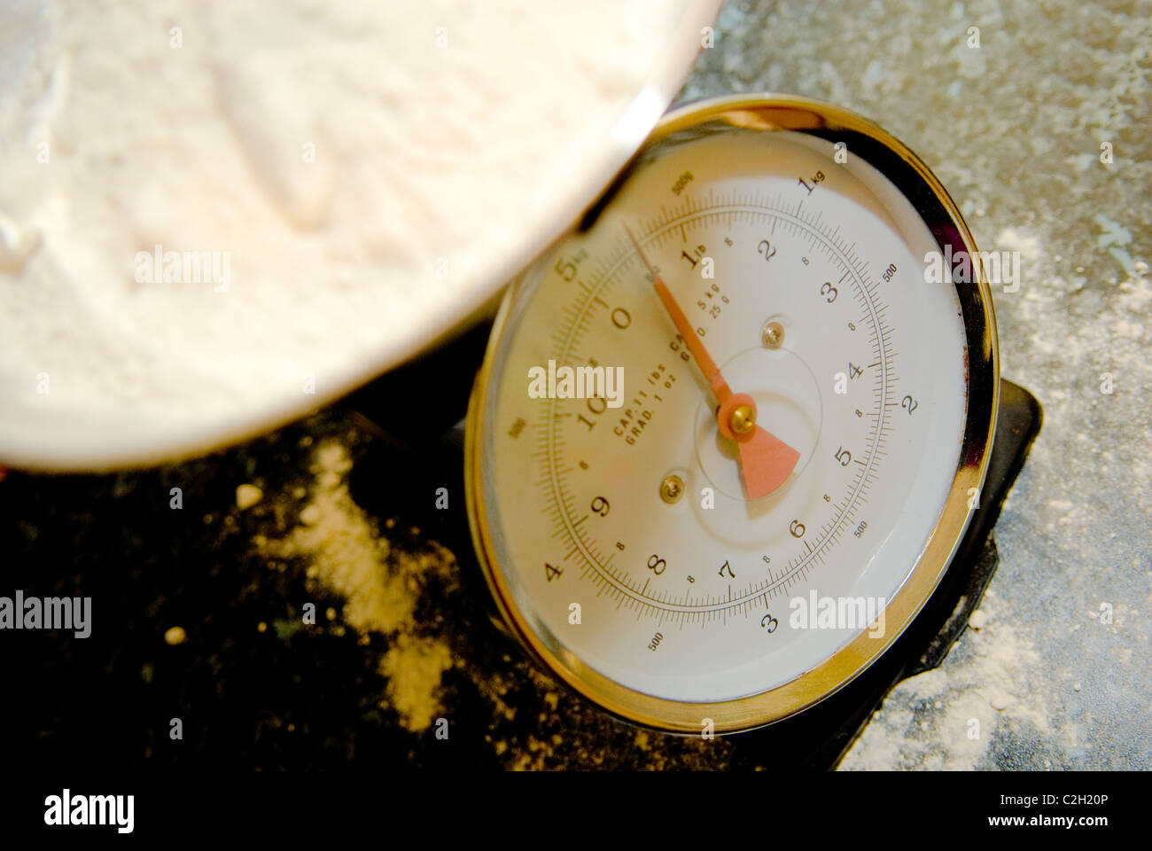 Flour measured out on scales Stock Photo Alamy